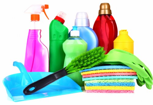 Domestic cleaner working in a Twickenham family home living room