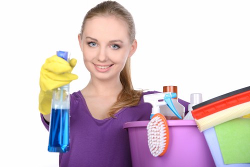 Cleaner preparing a kitchen and cupboards for a new resident in Twickenham